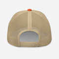 Tan mesh-backed trucker hat with orange button, ideal for rustic outdoor fashion