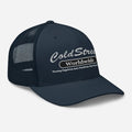 Navy blue ColdStreet Worldwide trucker hat with mesh back panel for stylish wear