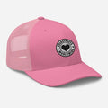 Pink mesh trucker cap featuring a black and white heart logo patch for CS Clothing Co