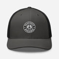 Gray and black trucker hat with circular peace sign logo, perfect for rustic style lovers