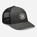 Gray and black trucker hat with smiley face logo from CS Clothing Co. in rustic style