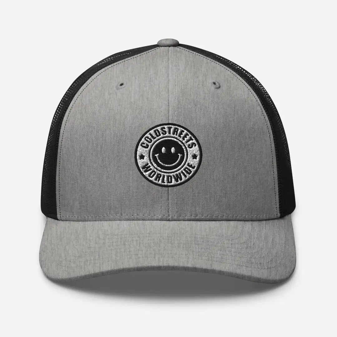Grey and black trucker hat with smiley face logo from CS Clothing Co. in black charcoal