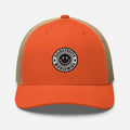 Orange and tan trucker-style baseball cap with smiley face patch by CS Clothing Co