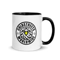 White ceramic mug with Coldstreets Worldwide logo and palm tree design on handle