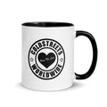 White ceramic mug with black interior and Coldstreets Worldwide logo heart design