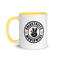 White coffee mug with yellow handle and Coldstreet Worldwide logo in pink golden yellow