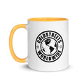 White ceramic mug with yellow handle and Coldstreets Worldwide logo in blue pink golden design