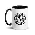 White coffee mug with black interior and Coldstreets Worldwide logo in green orange blue