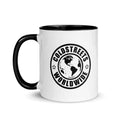 White coffee mug with black interior and Coldstreets Worldwide logo in blue pink golden