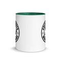 White ceramic mug with green interior and black logo from CS Clothing Co. in blue pink golden