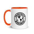 White ceramic mug with orange rim and handle featuring Coldstreets Worldwide logo design