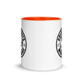 White ceramic mug with orange interior and black logo from CS Clothing Co. in dark blue red