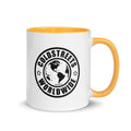 White ceramic mug with yellow handle and Coldstreets Worldwide logo in blue red design