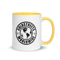 White ceramic mug with yellow handle and Coldstreets Worldwide logo for CS Clothing Co