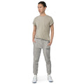 Person in casual grey t-shirt and unisex sweatpants from CS Clothing Co on cold streets