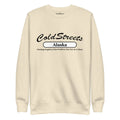 Cream-colored sweatshirt with Cold Streets Alaska text for grey white bone style