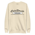 Cream-colored sweatshirt with ColdStreets Nebraska text, perfect with carbon grey white pants