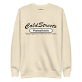 Cream-colored sweatshirt with Cold Streets Pennsylvania design for Dusty Rose Team fans