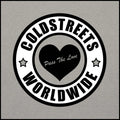 Circular black and white logo of Coldstreets Worldwide with heart in CS Clothing Co design