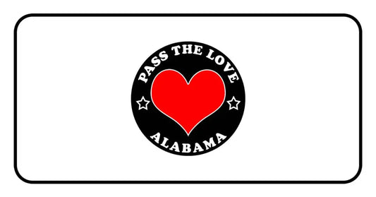 Black circular badge with red heart and text Pass The Love Alabama, perfect for clothing and paid cards