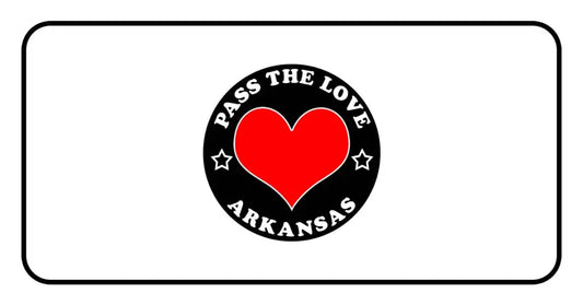 Black badge with red heart and ’Pass The Love Arkansas’ text for love-focused clothing