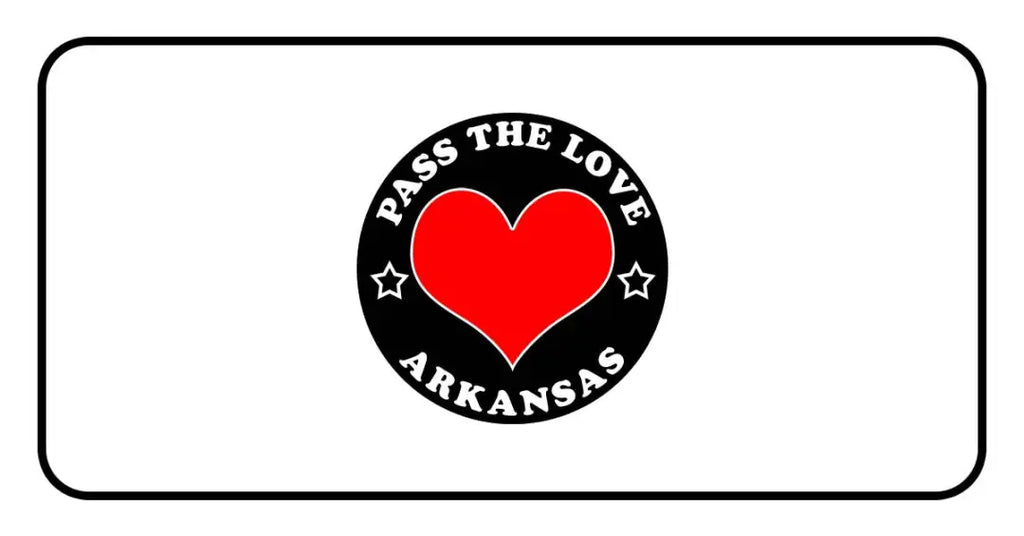 Black badge with red heart and ’Pass The Love Arkansas’ text for love-focused clothing