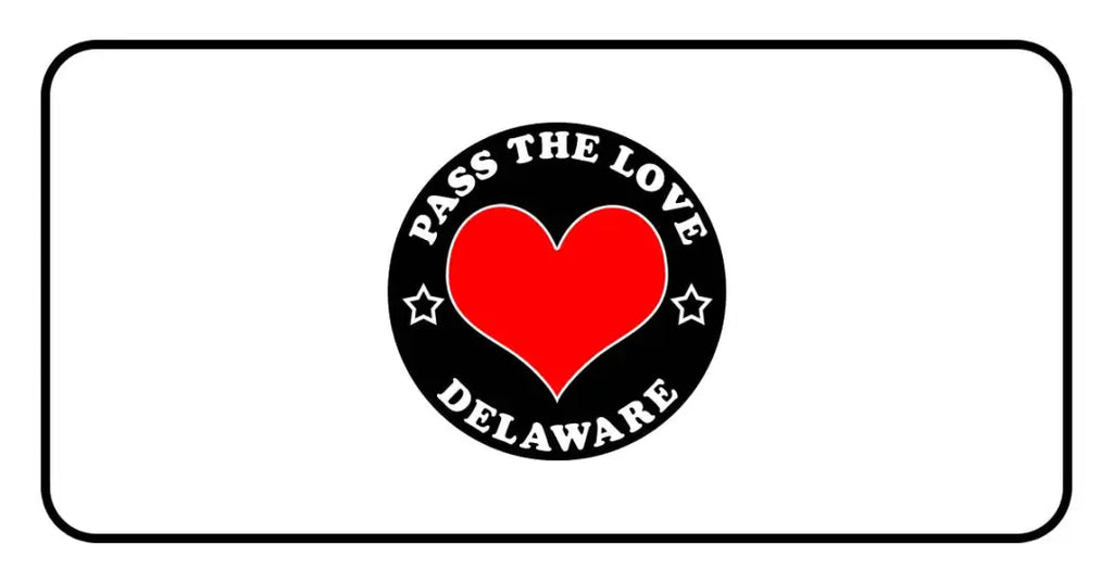 Black circular badge with red heart reading Pass The Love Delaware, surrounded by stars