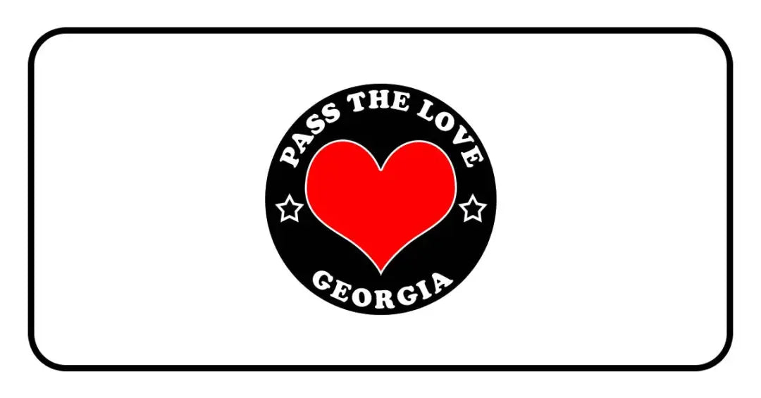 Circular black badge for Pass The Love Georgia featuring a red heart and love theme