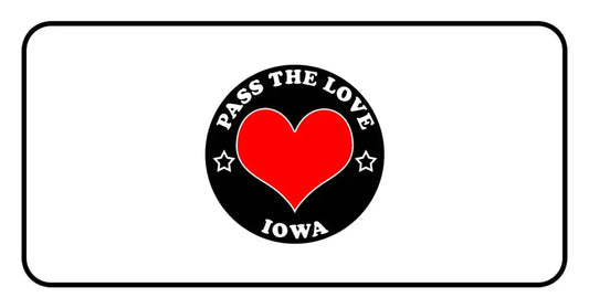 Circular black badge with PASS THE LOVE IOWA text and heart for love clothing in Iowa