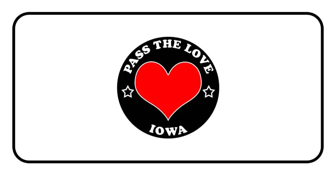Circular black badge with PASS THE LOVE IOWA text and heart for love clothing in Iowa