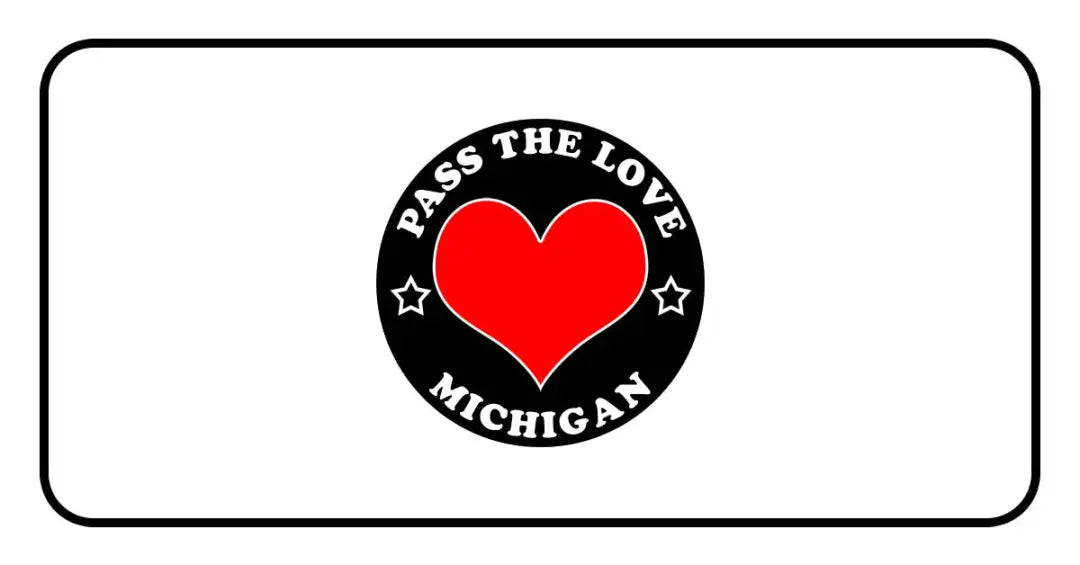 Black circular badge with a red heart and Pass The Love Michigan text for clothing