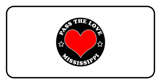 Black badge with red heart and Pass The Love Mississippi text, featuring stars design