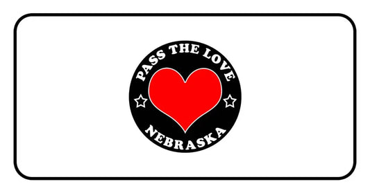 Black circular badge with red heart for Pass The Love Nebraska clothing and paid cards