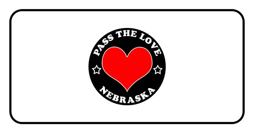 Black circular badge with red heart for Pass The Love Nebraska clothing and paid cards