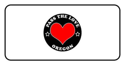 Black badge with PASS THE LOVE OREGON text and heart, perfect for love-themed clothing