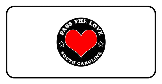 Black badge with a red heart and text Pass The Love South Carolina for paid cards