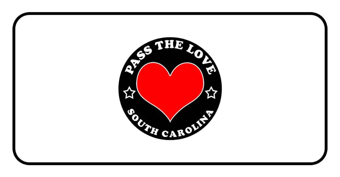 Black badge with a red heart and text Pass The Love South Carolina for paid cards