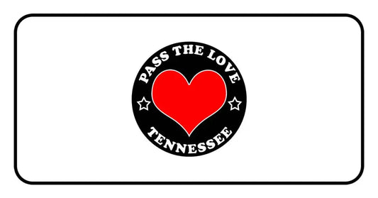 Black badge with red heart and text Pass The Love Tennessee, surrounded by stars