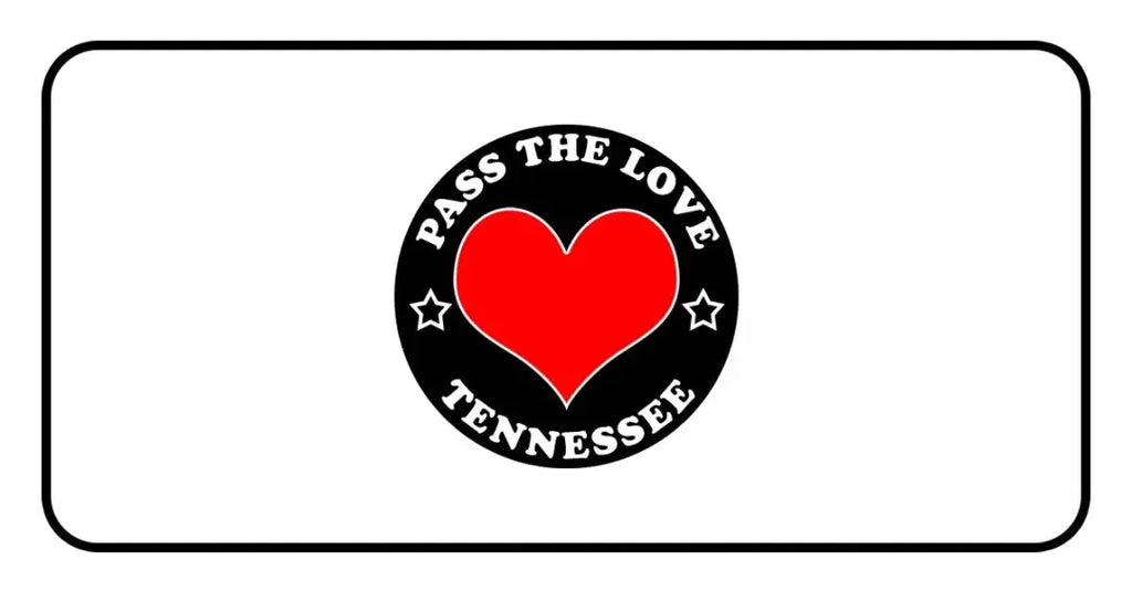 Black badge with red heart and text Pass The Love Tennessee, surrounded by stars